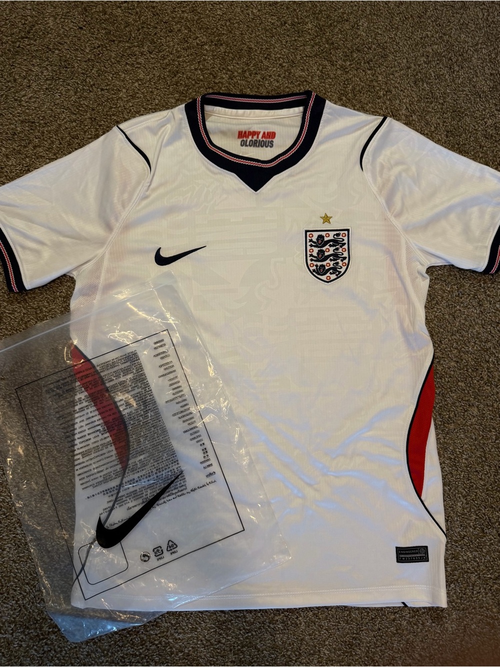 Nike White England Men's Football Jersey with Navy and Red Accents